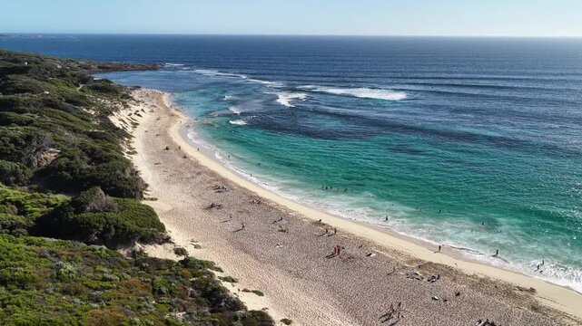 Ocean views people sunbathing & swimming Yallingup Beach blue skies 4k Western Australia