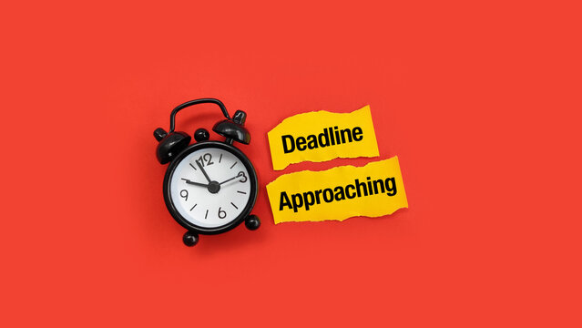 Deadline approaching concept with alarm clock and sticky note, highlighting urgency, time pressure, productivity, and work deadlines.