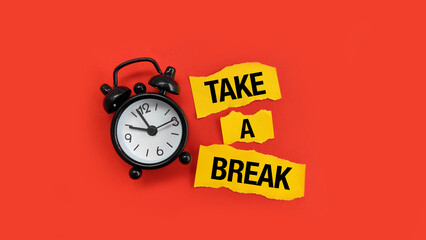 Take a break concept with alarm clock and bold text, representing work life balance, rest time and...