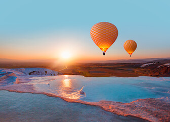 Hot air balloon flying over spectacular pamukkale - Natural travertine pools and terraces in Pamukkale. Cotton castle in southwestern Turkey, © muratart