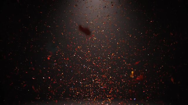 Cinematic fire embers falling in dark studio, glowing orange sparks and ash particles on black background, dramatic heat overlay effect