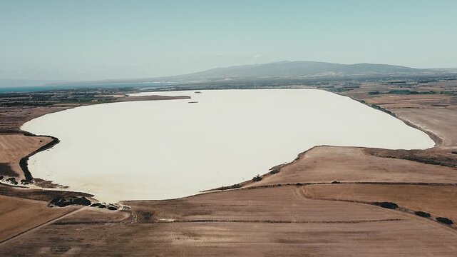 The outstanding beauty of Porcus salt desert by the town of Cabras in Sardinia seen from an aerial view
