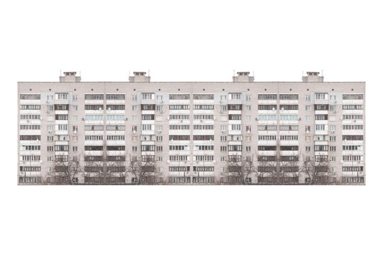 Nine-storey gray brick apartment building facade is isolated