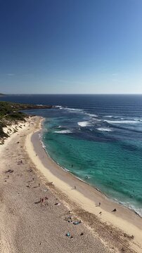 Ocean views people sunbathing & swimming Yallingup Beach blue skies 4k