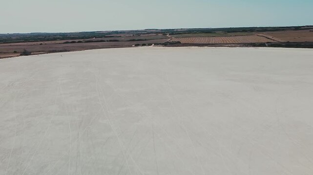The outstanding beauty of Porcus salt desert by the town of Cabras in Sardinia seen from an aerial view