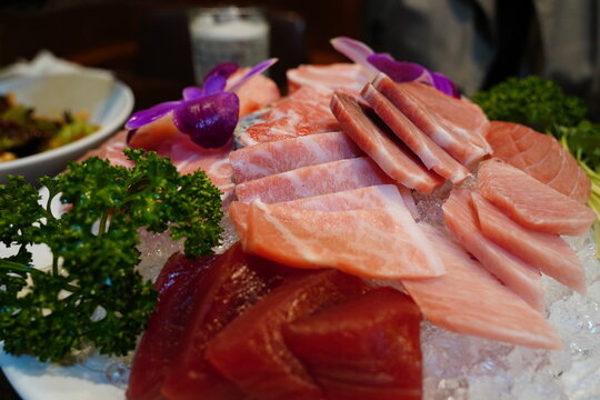 Close up of fresh red tuna akami and marbled otoro sashimi on ice