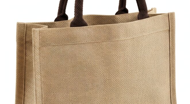 Close up of a beige jute tote bag with dark straps