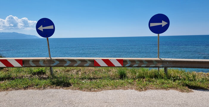mytikas beach in preveza perfecture greece spring season sunny day. arrows two ways signs