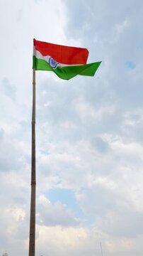 Indian national flag waving in the wind slow motion vertical video footage.