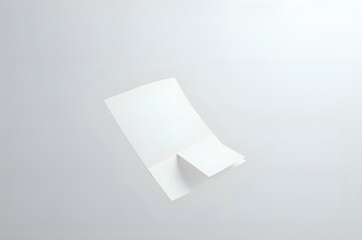 Naklejka premium Folded Paper Brochure on White Background