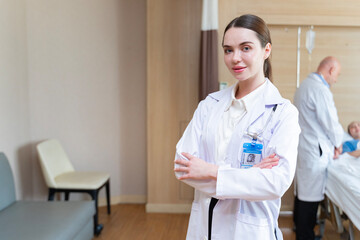 Portrait of caucasian woman doctor in patient wing inside hospital for healthcare and medical usage