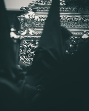 Nazareno in Hood in Front of Ornate Paso During Semana Santa in Andalusia, Spain
