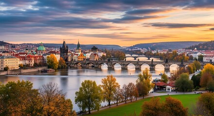 Obraz premium Prague cityscape at sunset with Charles Bridge and Vltava River.