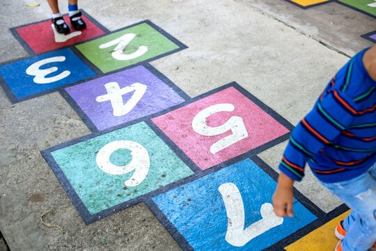 Colorful hopscotch game outdoors.