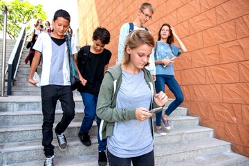 Fototapeta premium Students descending outdoor stairs together.