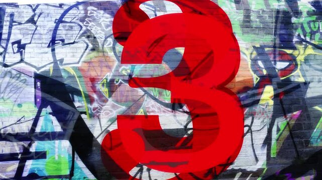 Urban Graffiti 54321 Countdown.
A high-energy, urban-style countdown featuring a large, vibrant red numbers layered over a complex graffiti-covered brick wall.
