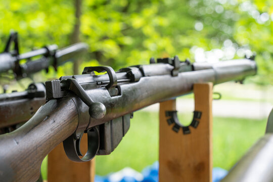 World War II British Lee Enfield rifle outdoors on a wooden stand