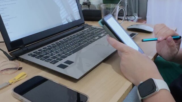 Hands demonstrating an efficient digital workflow, seamlessly using a tablet for specific tasks