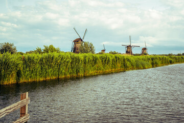 Fototapeta premium Authentic stone windmills of Kinderdijk over the water