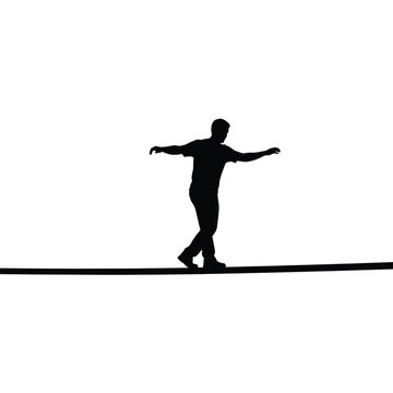 Silhouette of a person balancing on a tightrope with arms extended 1