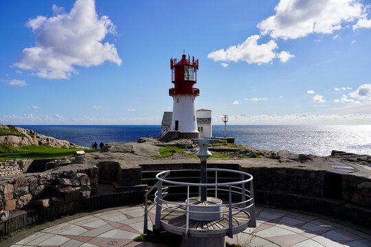Lindesnes, Agder, Norway - September 30th 2025: The white painted lighthouse at Lindesnes, Norway, beneath a blue sky with white clouds.