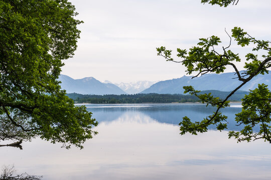 Perfect mountain reflection on the calm surface of Lake Staffelsee in the Blue Land, Bavaria
