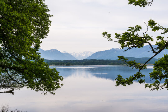 Perfect mountain reflection on the calm surface of Lake Staffelsee in the Blue Land, Bavaria