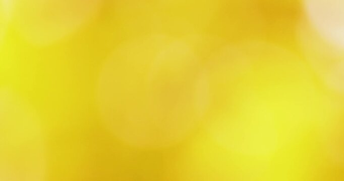 Soft golden bokeh background with warm gradient light. Bright, elegant, and relaxing mood. perfect for backdrops, presentations, and premium visual designs