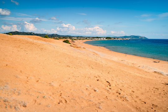 Wide sandy beach Issos on Greek island with turquoise water, landscape the most beautiful beaches of Corfu.
