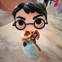 Obraz premium Rome, Italy - April 6, 2026, detail of the Harry Potter statuette, protagonist of the eponymous fantasy novel series written by J.K. Rowling.