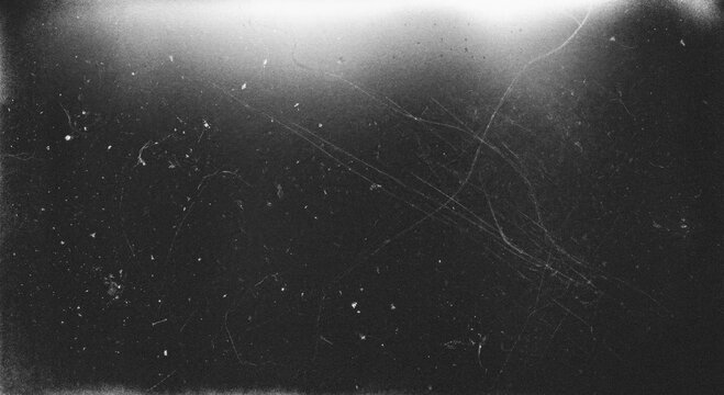 Vintage Monochrome Film Grain Effect Background with Top Light Bleed and Lens Flare Effect