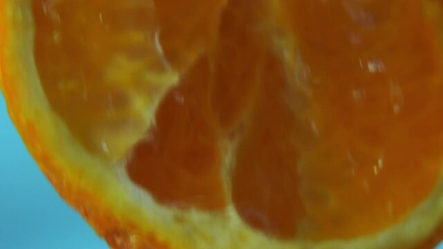 juice flows from a squeezed orange