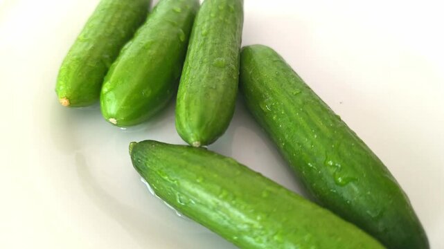 Cucumbers are rinsed in clear water with bubbles