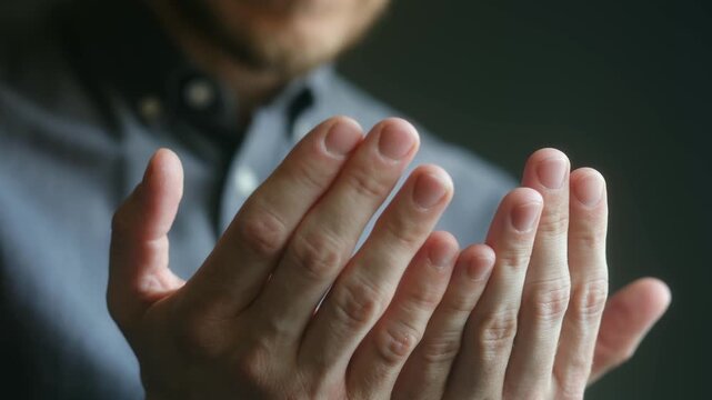 Close up devout muslim man hands held open in supplication during traditional islamic prayer, demonstrating faith, spirituality, moment of deep personal worship. Muslim man praying.