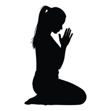 Silhouette of a young woman kneeling with hands clasped together in a gesture of prayer or deep contemplation her head bowed slightly and a ponytail cascading down her back conveying a sense of peace