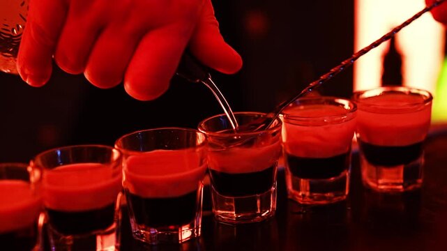 Mixing cocktails for a party with a bartender at a lively bar