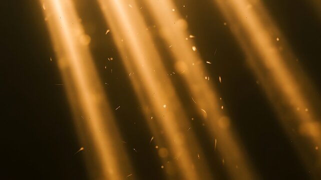 Warm golden light beams illuminating floating dust particles in a dark environment creating a serene atmosphere