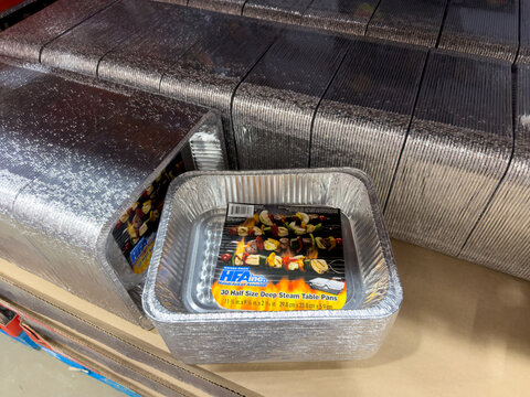 HFA Inc Handi-foil Half Size Deep Steam Table Pans Stacked on Shelf