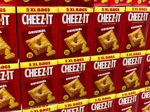 Multiple red boxes of Cheez-It Original baked snack crackers stacked on shelves