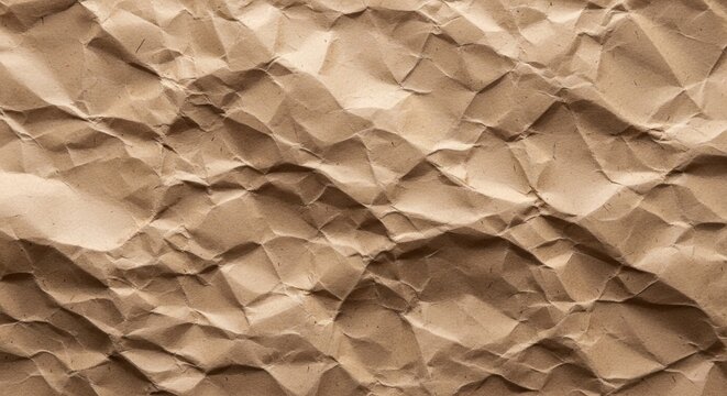 Close up texture of crumpled brown paper with deep shadows and highlights