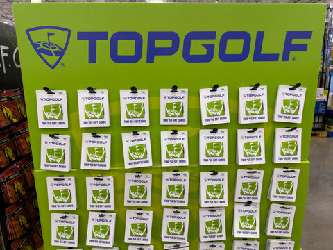 Multiple white and green Topgolf gift cards