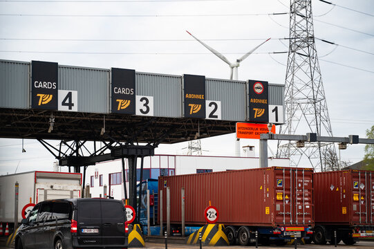 Highway Pass Cash Lane in Antwerp, Belgium, cars passing through the point of toll booth station on road, paying for traffic infrastructure