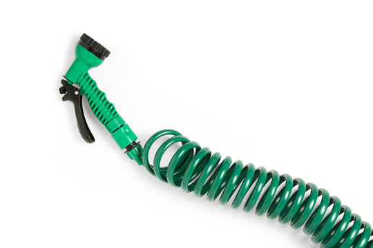 green spiral hose with spray gun isolated