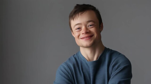 Thoughtful portrait of young man with Down syndrome, inclusive and respectful representation, natural light studio image, confidence and dignity concept young man