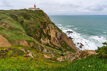 Cabo da Roca dramatic coastal cliff overlooking Atlantic Ocean in Portugal. Scenic westernmost...