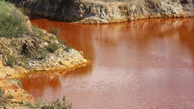 Polluted red water lake at the Lousal Mine in Portugal