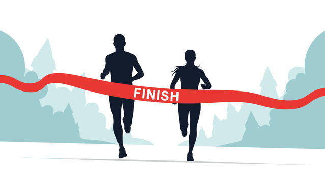Silhouettes of a male and female runner crossing the red finish line tape together after a long distance race in a park or forest.