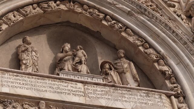 The historic interior of the Naples Cathedral. A Baroque marble sculpture of the Virgin Mary on the altar of the Assumption of the Blessed Virgin Mary, March 6, 2026.