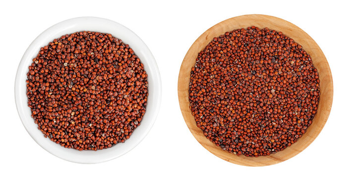red quinoa seeds in ceramic and wooden bowl isolated on a white background. Top view. Flat lay