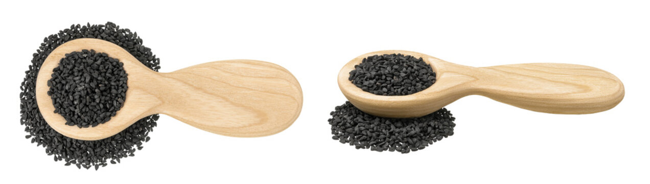 Nigella sativa or Black cumin in wooden spoon isolated on white background. Top view. Flat lay